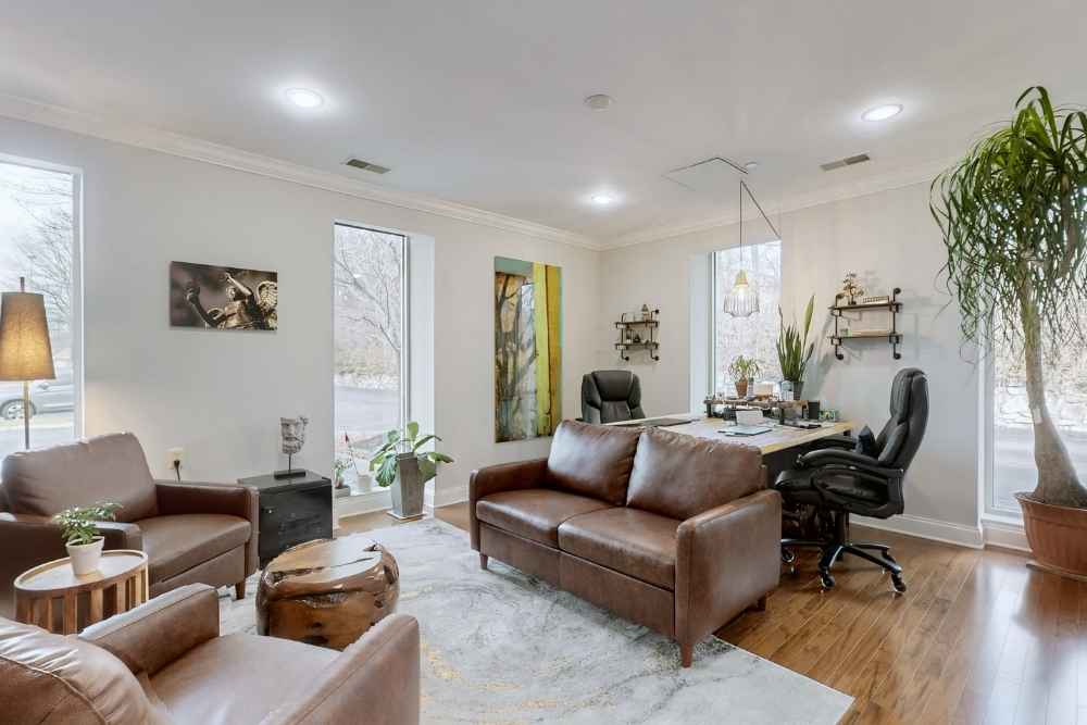 Modern therapy office with leather seating and natural light, designed for Sleep Disorders Treatment in Nashville, providing a calm and welcoming environment.