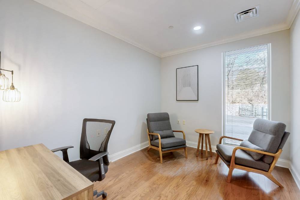 A cozy and professional therapy room setup used for pre- or post-session discussions in Equine Therapy in Nashville, offering a safe and welcoming environment for clients.
