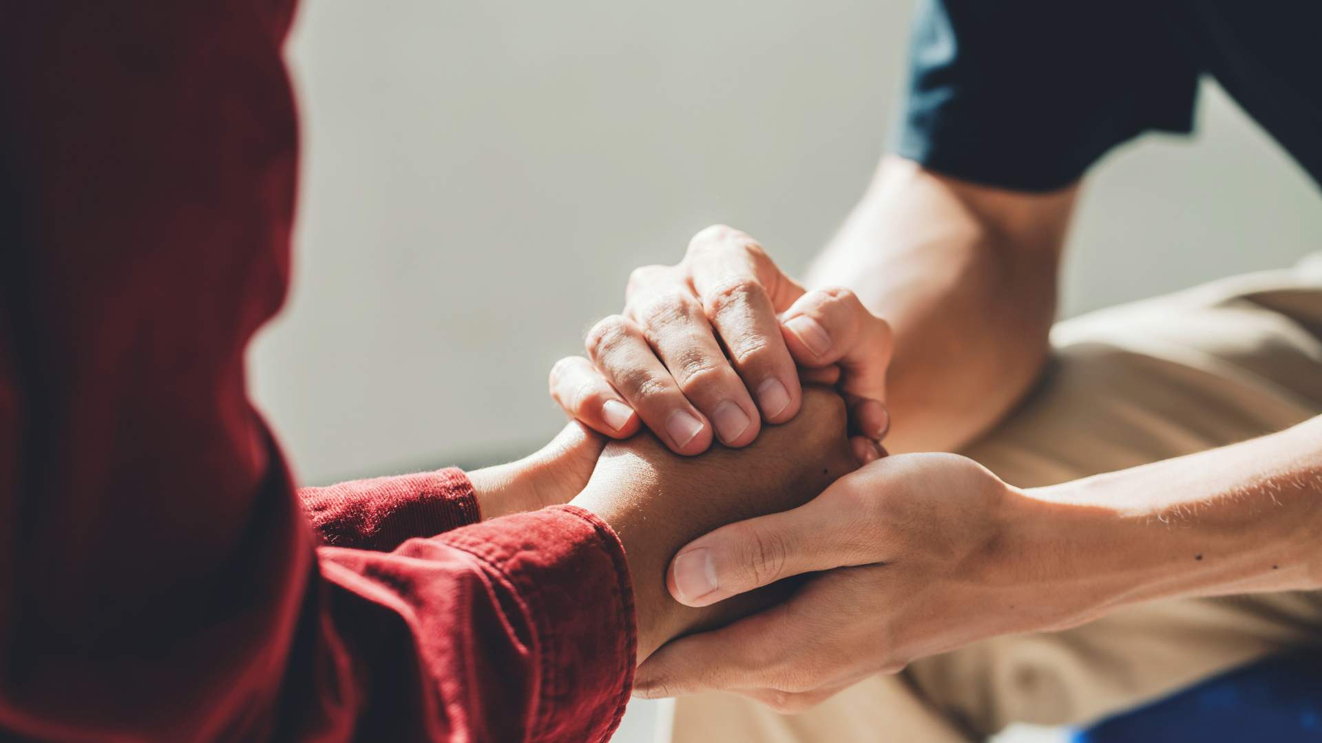 Holding hands during EMDR Therapy That Accepts Optum In Nashville, Tennessee